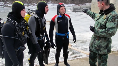 Scuba divers training in winter conditions